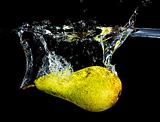 fresh pear dropping into water