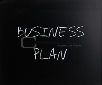 "Business plan" handwritten with white chalk on a blackboard