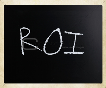 The word "ROI" handwritten with white chalk on a blackboard