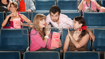 Men and Women Flirting in Theater
