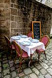 Dining table in front of the french medieval buildings