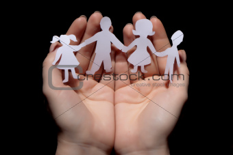 Paper chain family protected in cupped hands