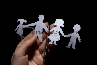 Paper chain family in hands, divorce