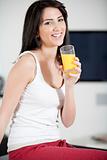 Young woman enjoying a glass of juice