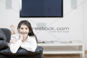 Young woman resting on sofa