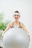 Healthy woman holding fitness ball