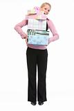 Full length portrait of woman holding stack of present boxes