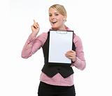 Woman employee showing blank clipboard