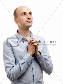 young man praying isolated on white