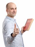 man holding an English book and shows his thumb up