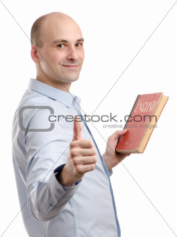 man holding an English book and shows his thumb up
