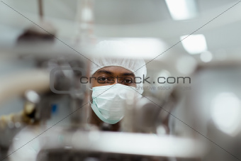 Male researcher checking equipment in biotech industry
