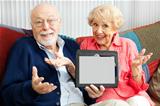 Senior Couple Confused by Tablet PC