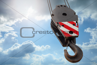 Crane hook on a blue sky 