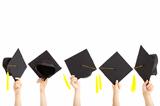 many hand holding graduation hats and isolated on white