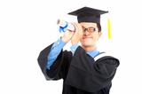 young graduating student watching by diploma