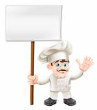 Waving chef holding sign