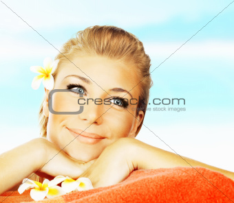 Woman on spa massage bed on the beach
