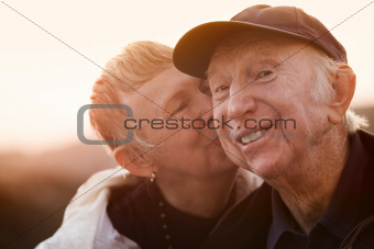 Woman Kisses Smiling Man