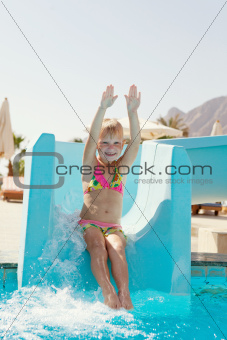 happy little girl on slide