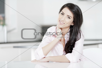 Young woman sat at table 