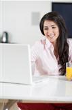 Girl chatting with friends on laptop
