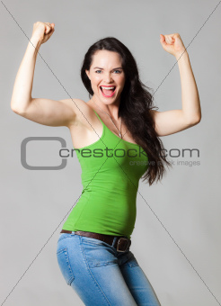 Happy woman flexing muscles