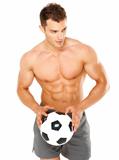 Handsome man holding soccer ball on white