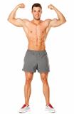 Full body of muscular man flexing his biceps on white