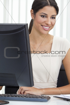 Hispanic Latina Woman or Businesswoman Using Computer in Office