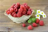 juicy ripe raspberries with mint leaves
