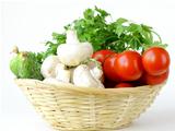 mushrooms, cucumbers, tomatoes and herbs in a basket
