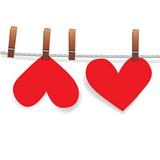 Red paper heart attached to a clothesline with pin