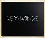 The word "Keywords" handwritten with white chalk on a blackboard