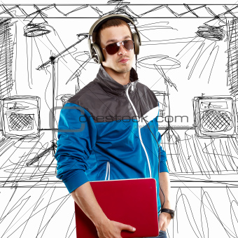 Man With Headphones And Laptop