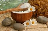 Spa still life with bath salts and daisies