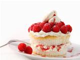 Raspberry and whip cream cupcakes on white
