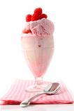 Raspberry sundae with napkin on white