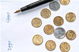 Closeup  accounting pen coins isolated copy space