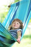little girl on a hammock