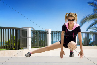 young woman doing stretching exercises outdoor
