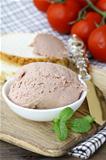 Homemade  liver appetizer pate  on a wooden board