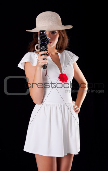 Young woman with vintage camera
