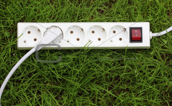an power strip lying on the grass