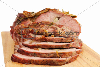 Roast pork on a wooden board