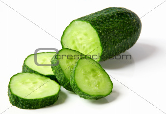 Fresh cucumber and slices on white background