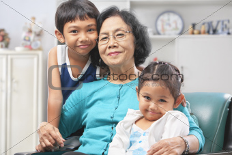 Grandmother and grandchildren at home
