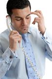 Troubled or depressed businessman making call