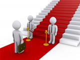 Businessman is refused access to stairs with red carpet