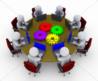Businessmen around table with laptops and four cogs